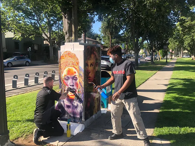  giving artists like Uli Smith paid opportunities, boosting local business, and shaping the city’s cultural identity