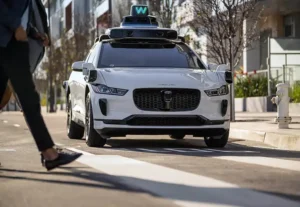 Uber and Lyft drivers stood together in protest against Waymo’s self driving taxis