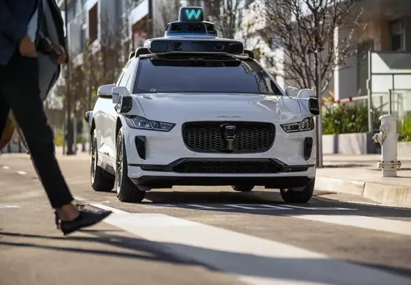 Uber and Lyft drivers stood together in protest against Waymo’s self driving taxis