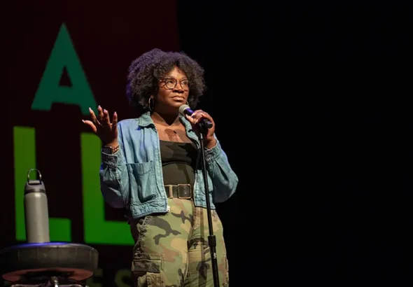 Comedian Becky Lynn onstage during the “In A Nutshell” storytelling series at The Sofia.