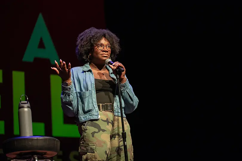 Comedian Becky Lynn onstage during the “In A Nutshell” storytelling series at The Sofia.