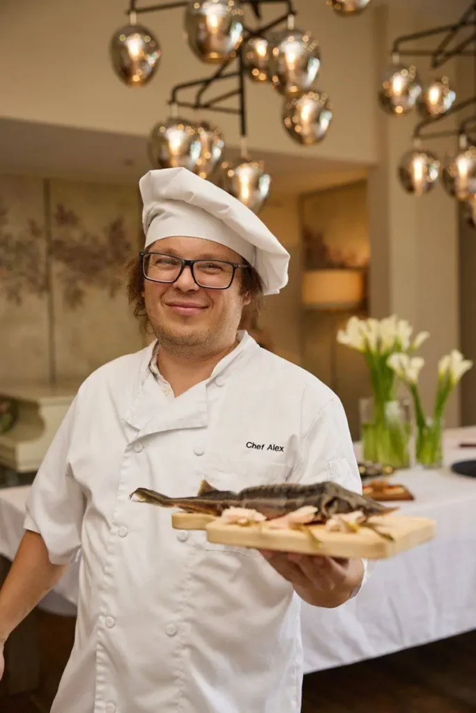 At the center of the evening is chef entrepreneur Aleksandr Krestnikov, moving easily between the kitchen 