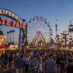 Thousands of people pour through the gates of the California State Fair carrying oversized drinks